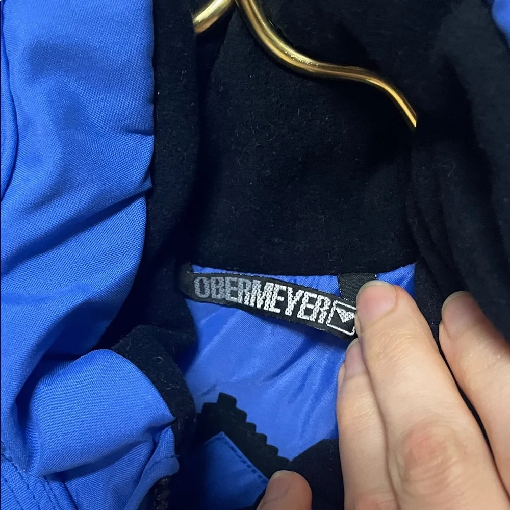 Obermeyer pants logo